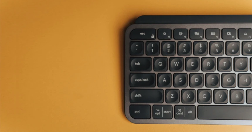 Image of a keyboard, the left half, on a yellow-ish background
